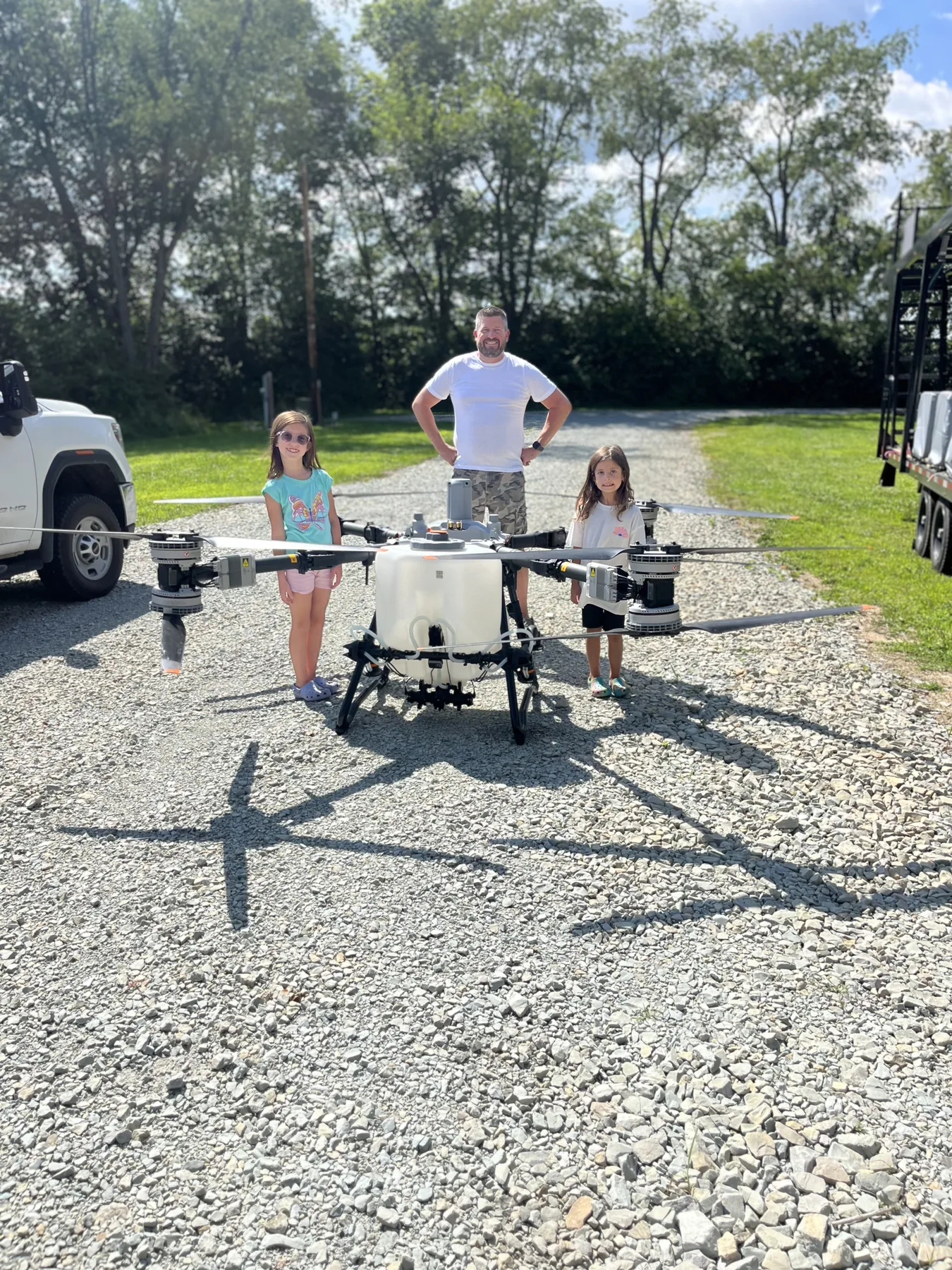 Bill with family and DJI Agras drone